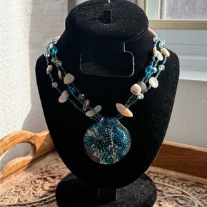 Gorgeous glass pendant with abalone shells